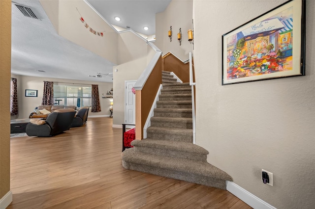 stairway featuring hardwood / wood-style floors