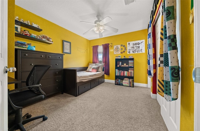 carpeted office with ceiling fan