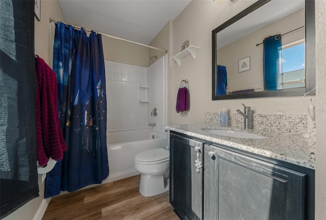 full bathroom with hardwood / wood-style flooring, vanity, shower / bathtub combination with curtain, and toilet