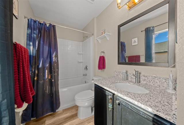 full bathroom with hardwood / wood-style flooring, vanity, shower / bath combination with curtain, and toilet