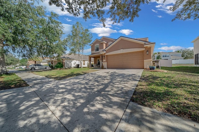 view of front of house with a garage and a front yard