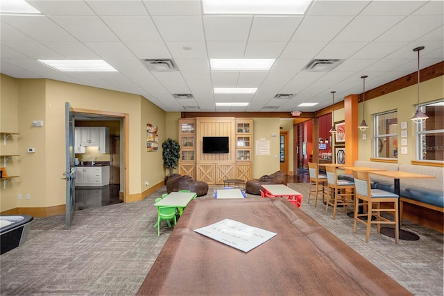 playroom with sink, carpet, and a drop ceiling