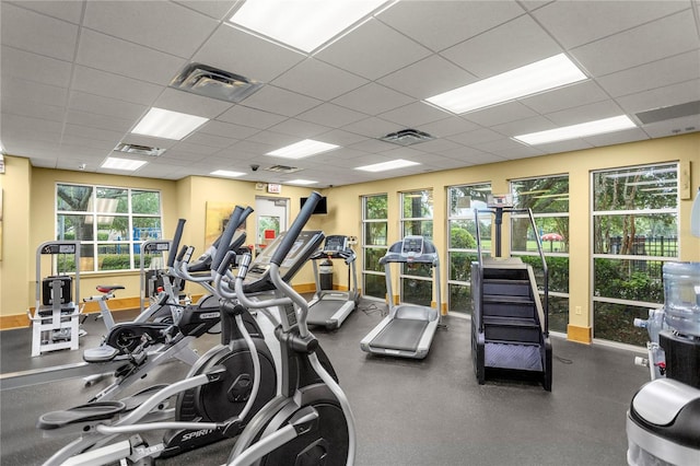 workout area featuring a drop ceiling