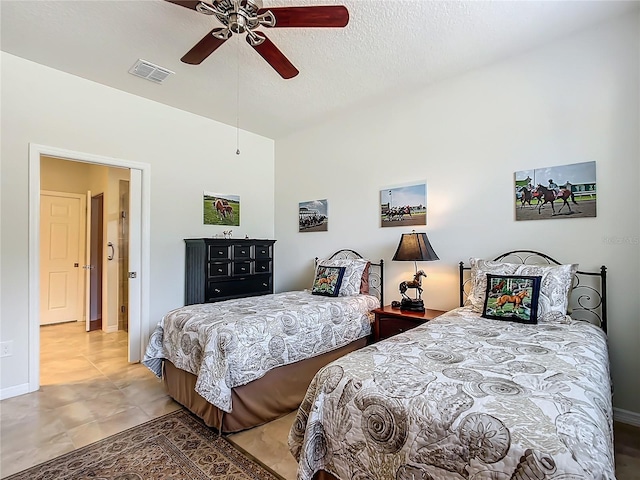 bedroom with vaulted ceiling, ceiling fan, and a textured ceiling