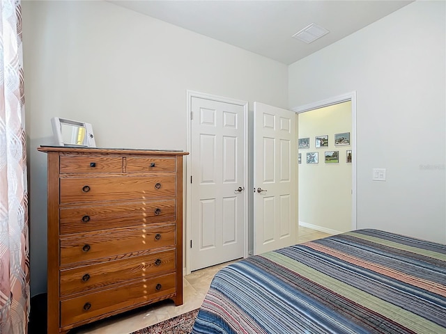 bedroom with light tile patterned floors