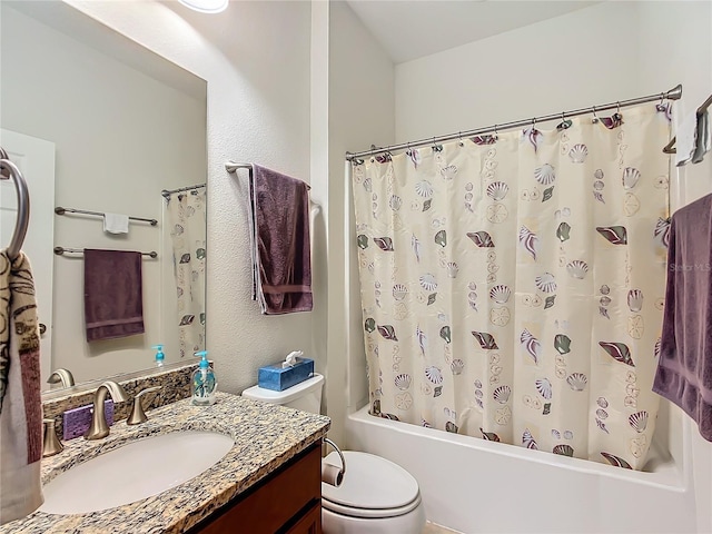 full bathroom featuring vanity, toilet, and shower / bath combo with shower curtain