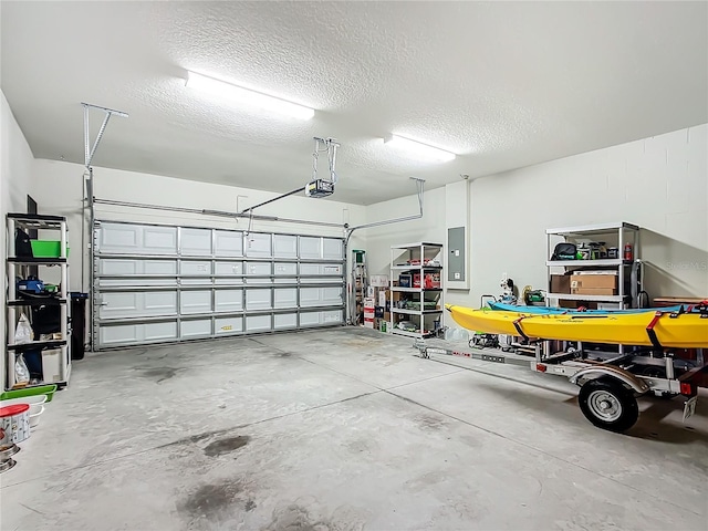 garage featuring a garage door opener and electric panel