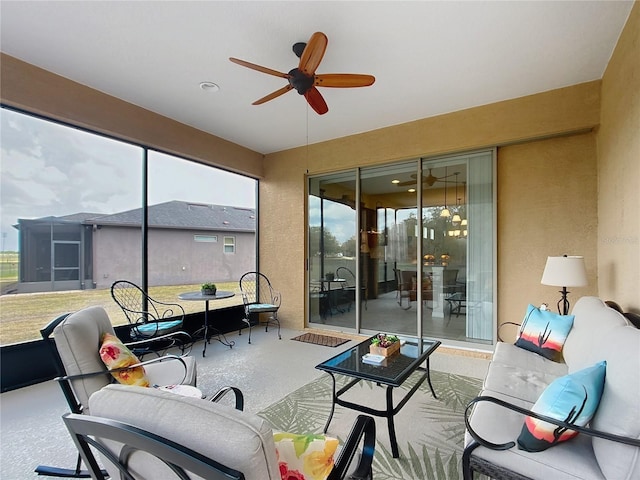 sunroom / solarium with plenty of natural light and ceiling fan