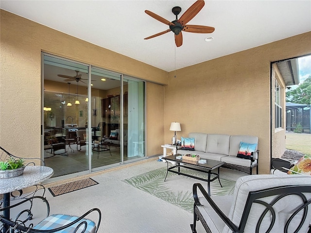 view of patio / terrace with an outdoor living space and ceiling fan