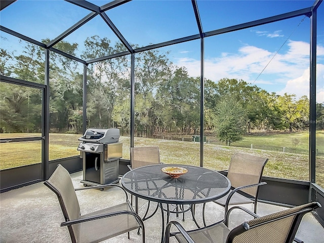 sunroom / solarium featuring a healthy amount of sunlight