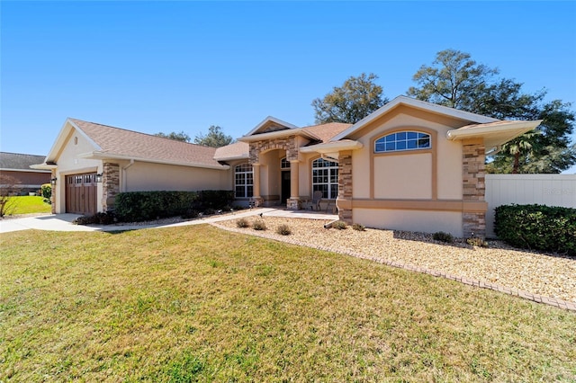 view of front facade featuring a garage and a front lawn