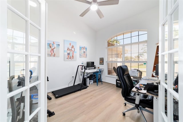 office area featuring lofted ceiling, plenty of natural light, ceiling fan, and light wood-type flooring