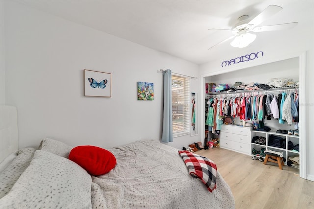 bedroom featuring ceiling fan, light wood-type flooring, and a closet