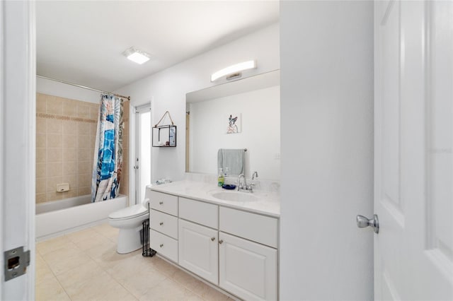 full bathroom with tile patterned flooring, vanity, shower / bath combo with shower curtain, and toilet