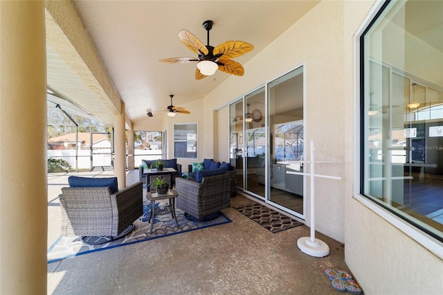 view of patio with a lanai, outdoor lounge area, and ceiling fan