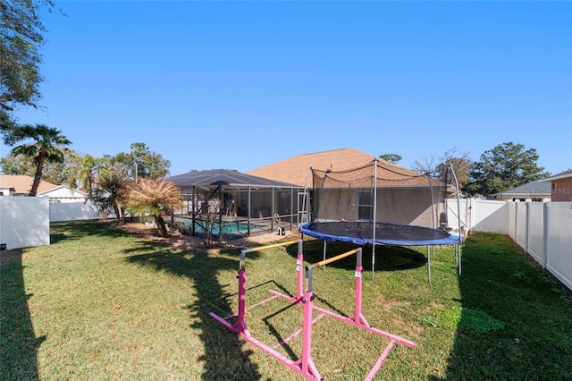 view of yard with a fenced in pool