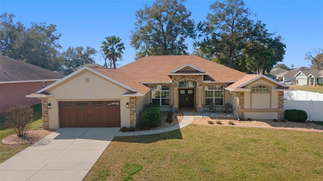 view of front of home featuring a garage and a front yard