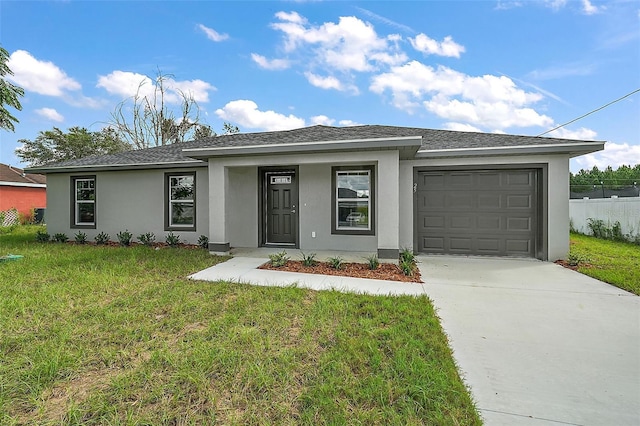 view of front of home with a garage and a front yard