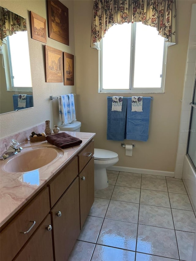 5500 NW 23rd Pl, Ocala, FL 34482 - bathroom with vanity, tile patterned floors, and toilet