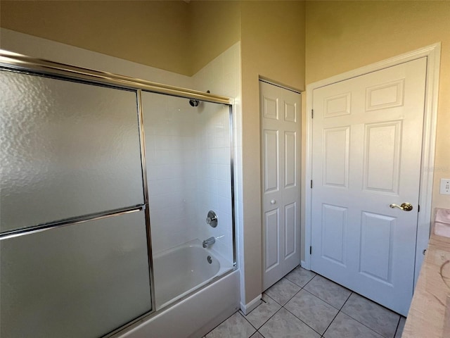 5500 NW 23rd Pl, Ocala, FL 34482 - full bath featuring tile patterned flooring and bath / shower combo with glass door