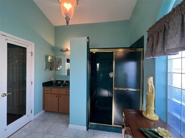 5500 NW 23rd Pl, Ocala, FL 34482 - full bathroom featuring vanity, tile patterned flooring, baseboards, and a shower stall