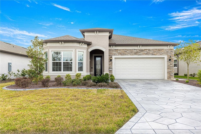 view of front facade with a garage and a front lawn