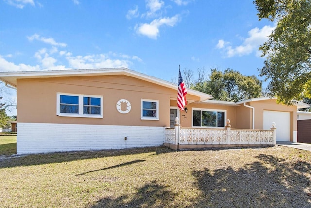 ranch-style home with a garage and a front yard