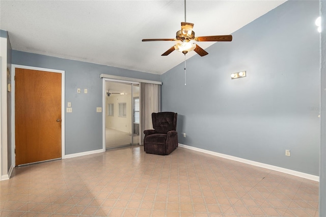 unfurnished room featuring ceiling fan and lofted ceiling