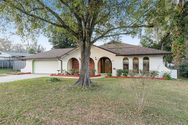 view of front of property with a garage and a front yard