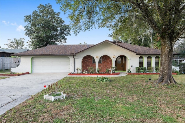 single story home with a garage and a front yard