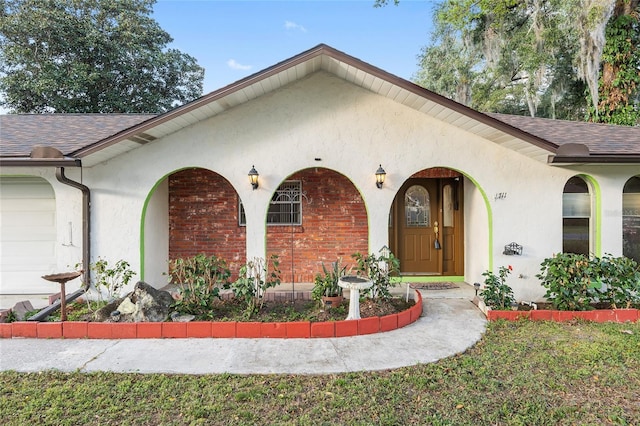 entrance to property featuring a garage