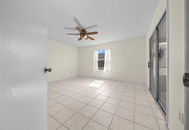 912 Chula Ct, Lady Lake, FL 32159 - tiled empty room featuring ceiling fan and a textured ceiling