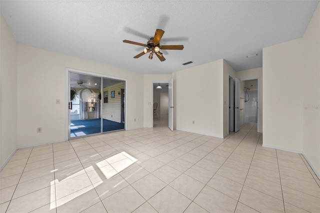 912 Chula Ct, Lady Lake, FL 32159 - tiled empty room featuring a textured ceiling and ceiling fan
