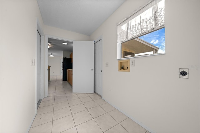 912 Chula Ct, Lady Lake, FL 32159 - corridor featuring lofted ceiling and light tile patterned floors