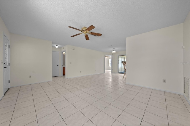 912 Chula Ct, Lady Lake, FL 32159 - tiled empty room featuring a textured ceiling and ceiling fan