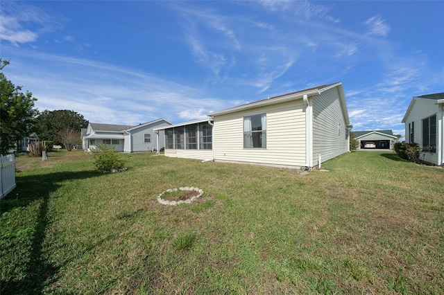 912 Chula Ct, Lady Lake, FL 32159 - back of property with a yard and a sunroom