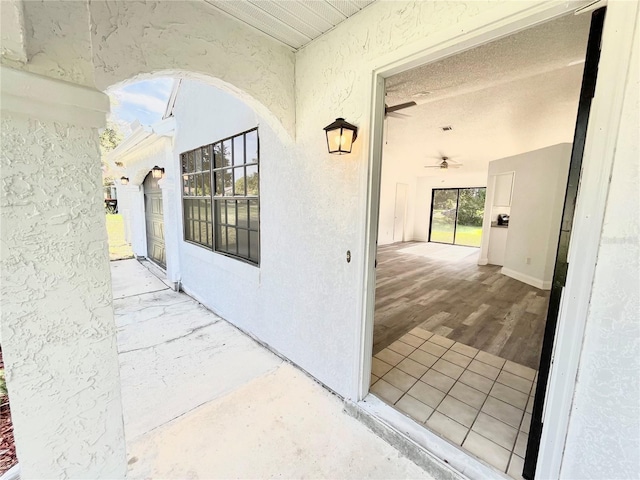 entrance to property featuring a patio