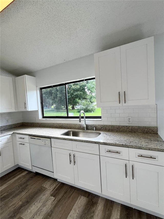 kitchen featuring dark hardwood / wood-style flooring, sink, white cabinets, and white dishwasher