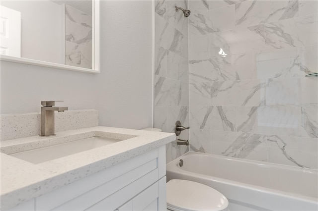 full bathroom featuring vanity, toilet, and tiled shower / bath combo