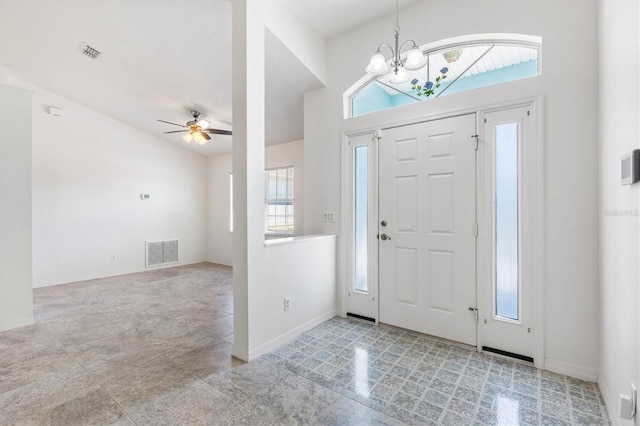 foyer entrance featuring visible vents, baseboards, and ceiling fan with notable chandelier