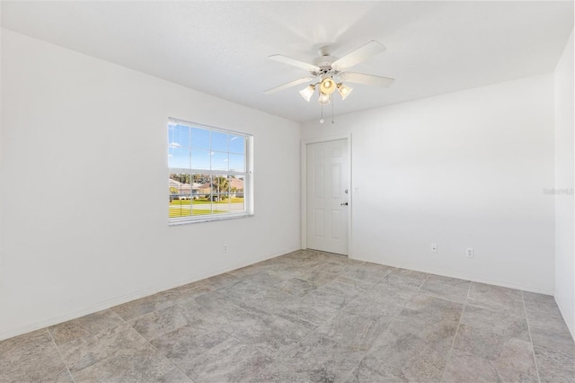 spare room featuring a ceiling fan