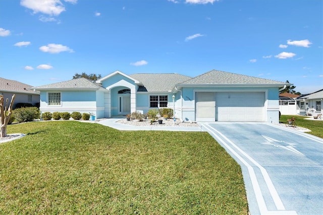 ranch-style home featuring a garage, a front lawn, and stucco siding