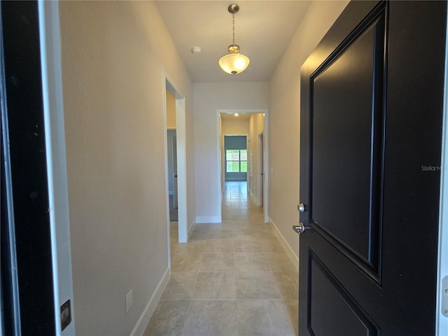 336 W Twisted Oaks Dr, Beverly Hills, FL 34465 - hallway featuring baseboards and light tile patterned flooring