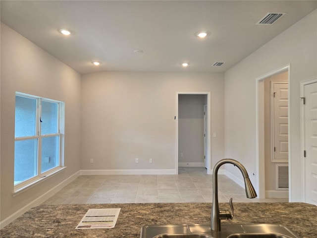 336 W Twisted Oaks Dr, Beverly Hills, FL 34465 - kitchen with recessed lighting, light tile patterned floors, and dark stone counters