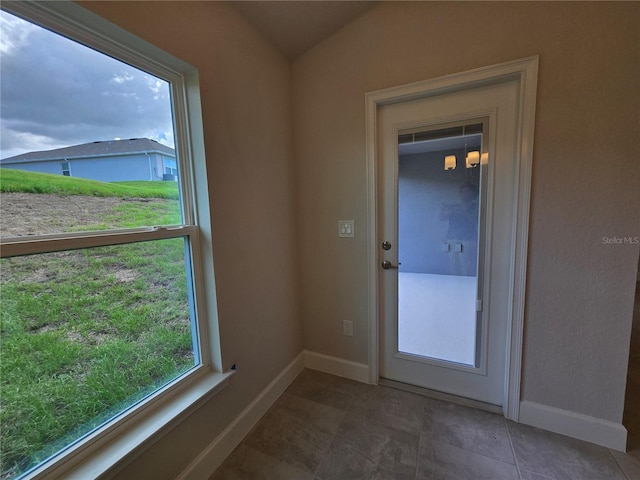 336 W Twisted Oaks Dr, Beverly Hills, FL 34465 - doorway to outside with baseboards and vaulted ceiling