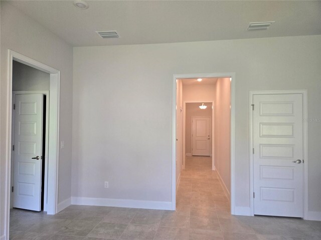 336 W Twisted Oaks Dr, Beverly Hills, FL 34465 - unfurnished room featuring baseboards and light tile patterned floors