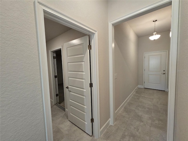 336 W Twisted Oaks Dr, Beverly Hills, FL 34465 - corridor with a textured wall and baseboards