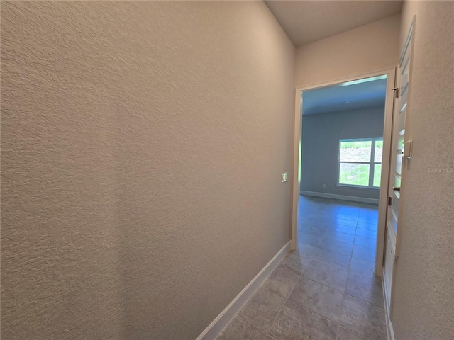 336 W Twisted Oaks Dr, Beverly Hills, FL 34465 - hallway featuring a textured wall and tile patterned flooring