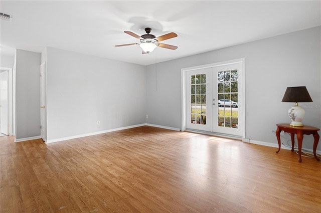 23761 SW Plaza Ct, Dunnellon, FL 34431 - unfurnished room featuring ceiling fan, light hardwood / wood-style floors, and french doors