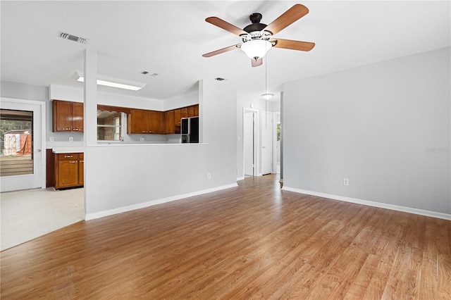 23761 SW Plaza Ct, Dunnellon, FL 34431 - unfurnished living room featuring light wood-type flooring and ceiling fan